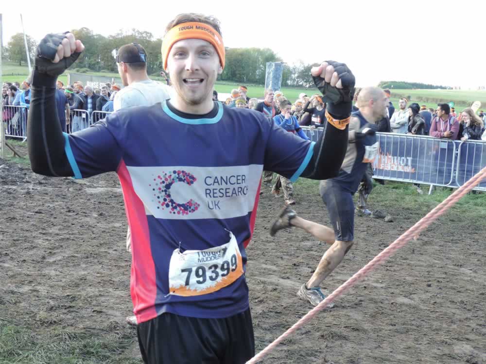Calum crosses the line after completing the Tough Mudder
